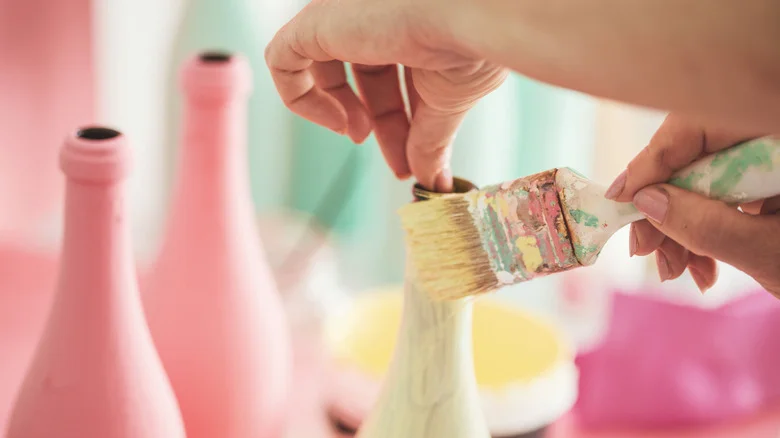16 Smart Ways To Repurpose Empty Alcohol Bottles In Your Home & Garden