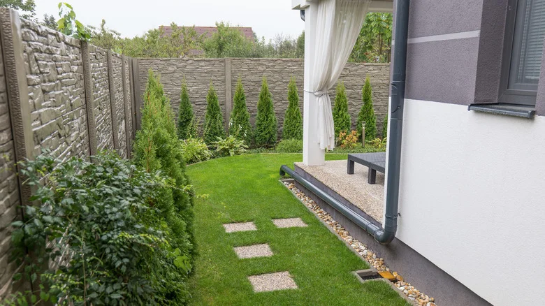 How To Turn The Unsightly Downspout In Your Yard Into A Stunning Display