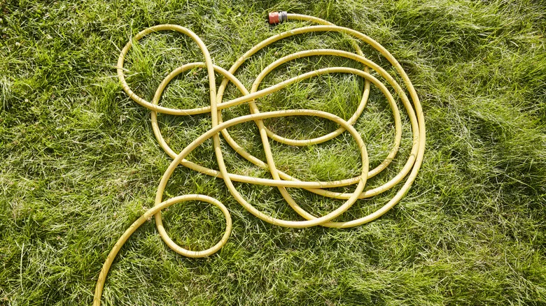 Reuse An Old Garden Hose To Help With Heavy Lifting Around The Yard