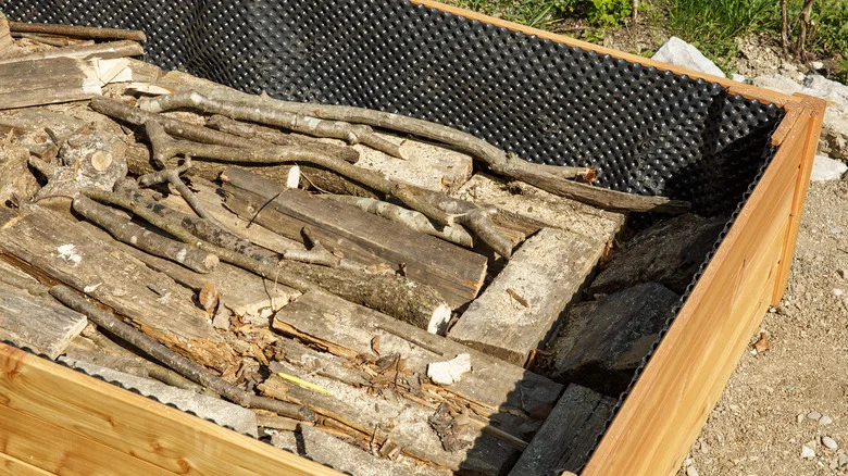 What You Should Know Before Adding Logs To A Raised Garden Bed