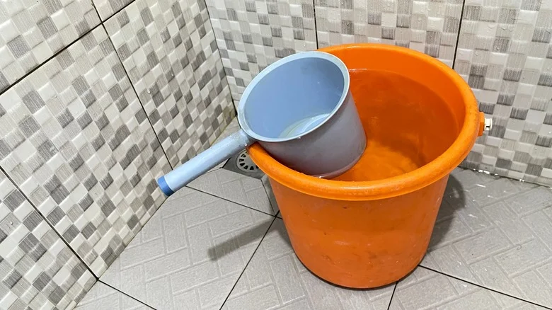 Why Keeping A Bucket In Your Shower May Help Cut Down On Your Water Bill