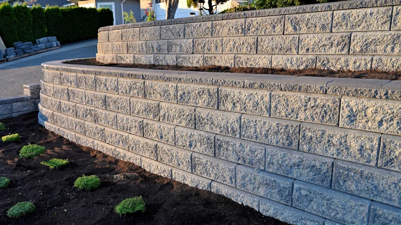 You Don’t Need Concrete: Upgrade Your Retaining Wall With A Basic Yard Staple
